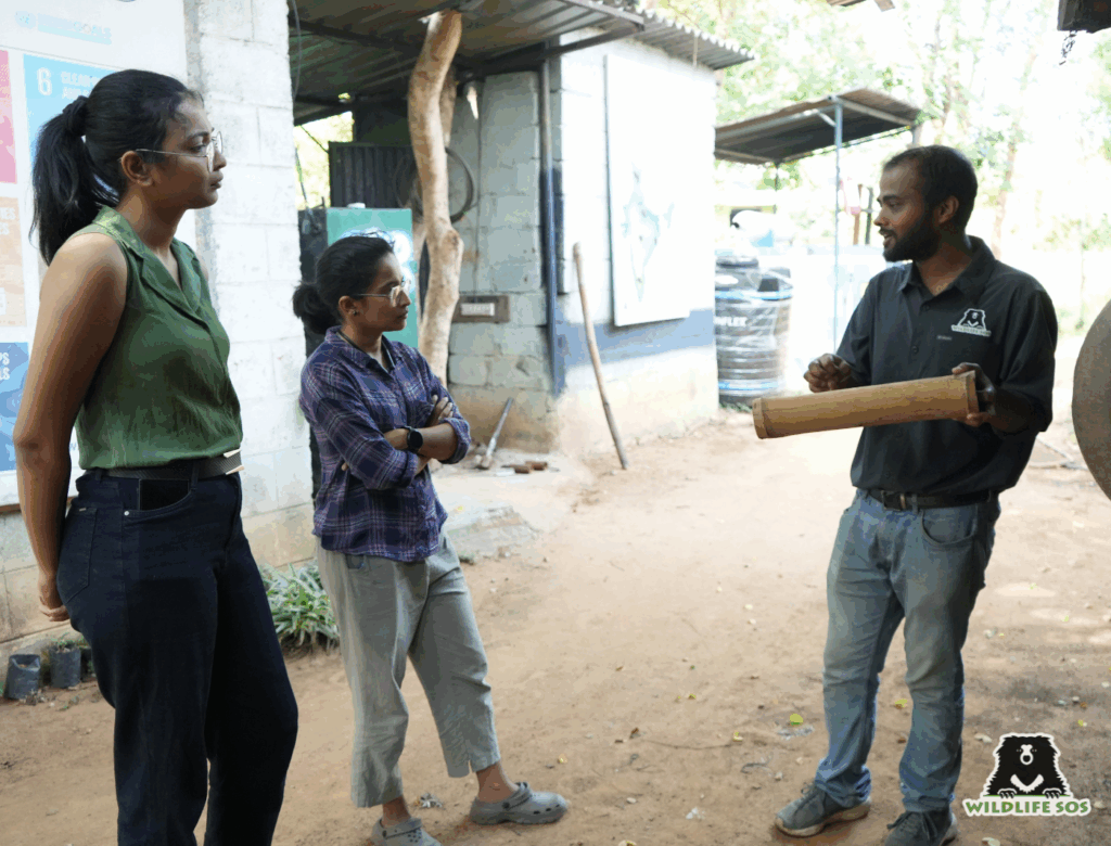 An education officer explaining the visitors about Bannerghatta Bear Rescue Centre (BBRC)